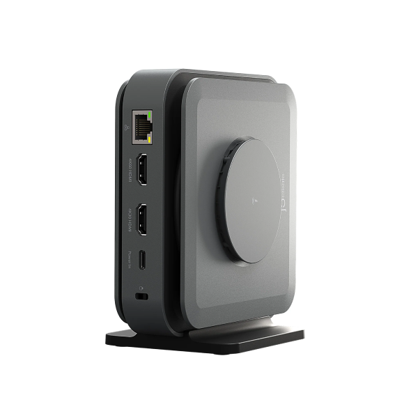 A sleek, dark gray and black electronic device with a circular front panel and side ports, standing on a matching base against a solid white background.