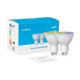 BrookLink smart GU10 LED bulb with its retail packaging box and a small instruction card, shown on a clean white background. The smart bulb features a white body and a transparent dome lens that displays a colorful rainbow spectrum.