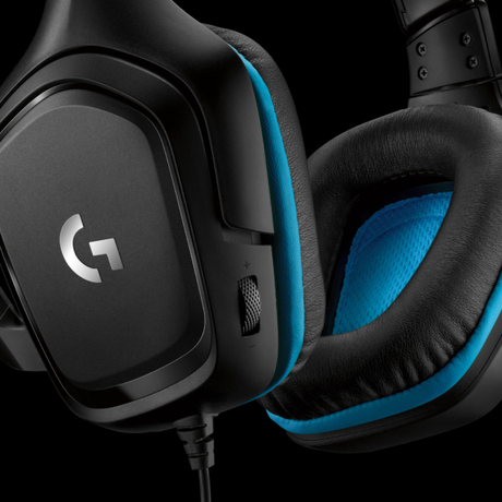Close-up of a Logitech gaming headset in black with bright blue accents on the ear cushions and outer ear cup trim, shown against a black background.