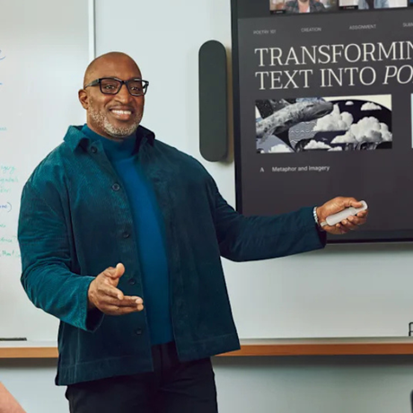 Presenter holding sand Logitech Spotlight 2 during a presentation