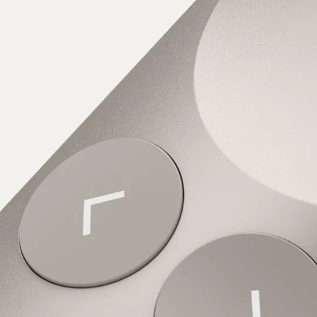 Close-up of sand Spotlight 2 slide navigation buttons