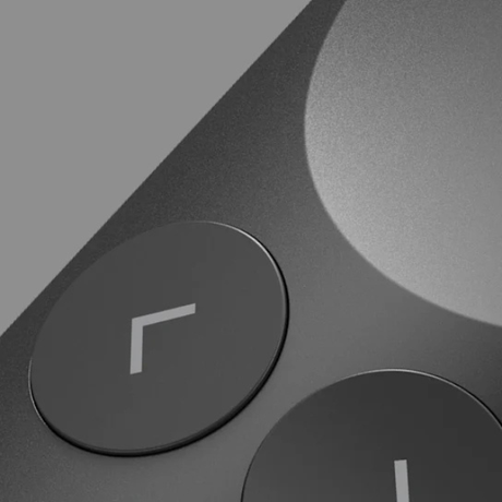 Close-up of graphite Spotlight 2 slide navigation buttons