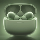 A pair of wireless earbuds inside an open charging case, shown in a matching light sage green color with a soft glowing background.