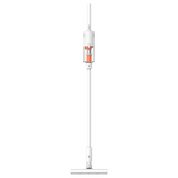 A cordless stick vacuum cleaner with a white body and a clear dust bin containing orange debris, shown against a solid white background.