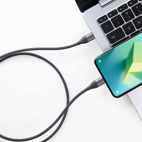 -Xiaomi_6A_Braided_USB-C_to_USB-C_Cable_2m-1-Smartphone connected to a laptop via a cable on a white background-DokkanTech 