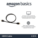 Amazon Basics HDMI cable shown on a white background with product text and feature callouts. The coiled black cable has HDMI connectors on both ends, and the image includes text stating it is 2.