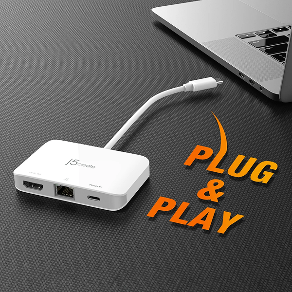j5create JCA351USB - Cto 4K HDMI Ethernet Adapter - DokkanTech White USB hub with cable on a dark surface next to a laptop, with 'Plug & Play' text.