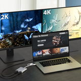 Laptop displaying a video on demand platform with two monitors showing 2K and 4K content.