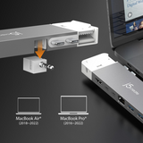 Laptop dock with ports for MacBook Air and MacBook Pro on a dark surface