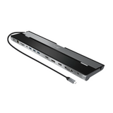 A slim black and silver USB-C hub with multiple ports on one end and a black cable extending from the other, shown on a plain white background.
