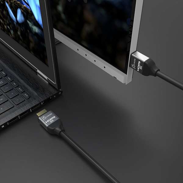 j5create JDC53 UltraHigh-Speed 8K UHD HDMI Cable 6.6ft -DokkanTech Laptop connected to a monitor with HDMI cables on a dark surface