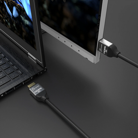 j5create JDC53 UltraHigh-Speed 8K UHD HDMI Cable 6.6ft -DokkanTech Laptop connected to a monitor with HDMI cables on a dark surface