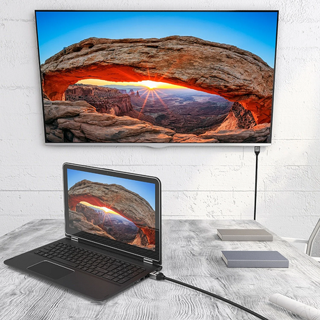 j5create JDC53 UltraHigh-Speed 8K UHD HDMI Cable 6.6ft -DokkanTech Laptop and TV displaying a scenic view of a canyon with a sunset.