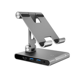 Silver tablet stand with multiple USB ports on a white background