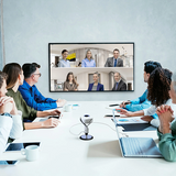 j5create JVU368 360° AI-Powered Webcam with Speakerphone Group of people in a video conference meeting in a modern office setting.