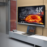 j5create JDC52 Premium High-Speed HDMI®™ Cable with Etherne  (6.6ft) A 6.6 ft (2m) 4K HDMI cable 4K TV displaying a car in flames with a laptop on a stand below.
