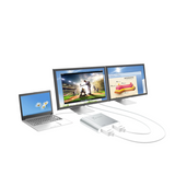Laptop connected to two monitors displaying different content on a white background