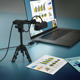 Laptop with a document camera displaying charts on a blue surface