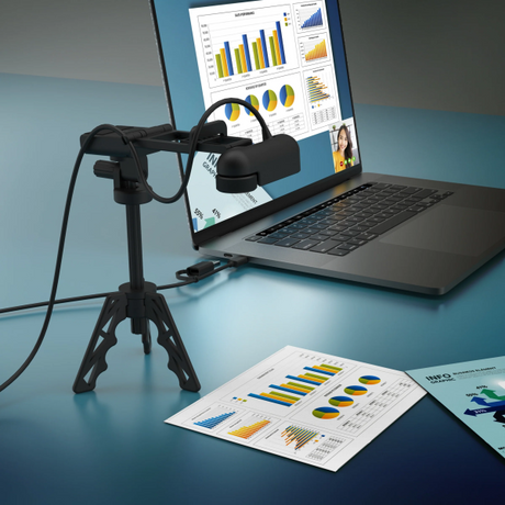 Laptop with a document camera displaying charts on a blue surface